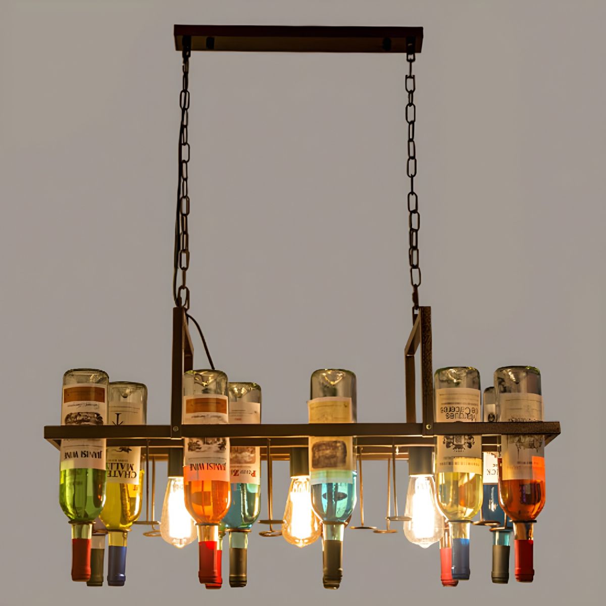 Overhead view of the Clérachic Wine Bottle Glass Pendant Light, filament bulbs glowing among mixed glass bottles.