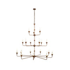The Clérachic Wisp Grande chandelier's three-tier silhouette centers a slender bronze column on white.