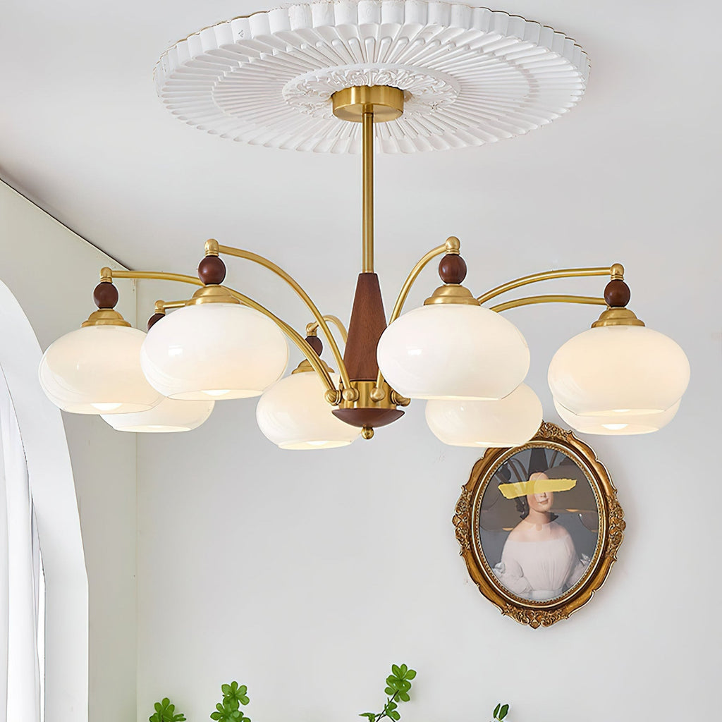 Clérachic Wood and Brass Chandelier in white glass, eight shades lit under a fluted ceiling medallion.