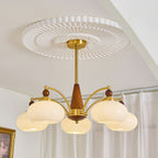 Clérachic five-light Wood and Brass Chandelier in white glass, hung under a fluted plaster ceiling rose.