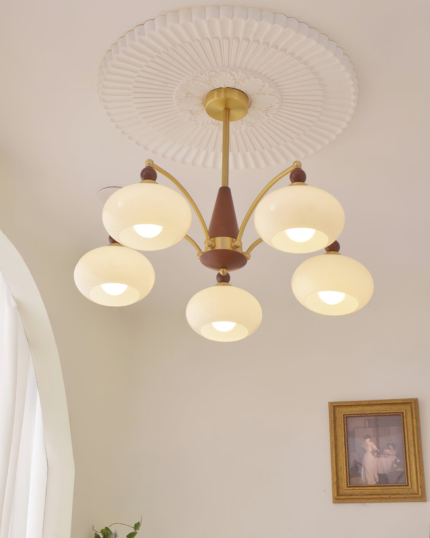Clérachic five-light Wood and Brass Chandelier in white, glowing under a sunburst plaster ceiling rose.
