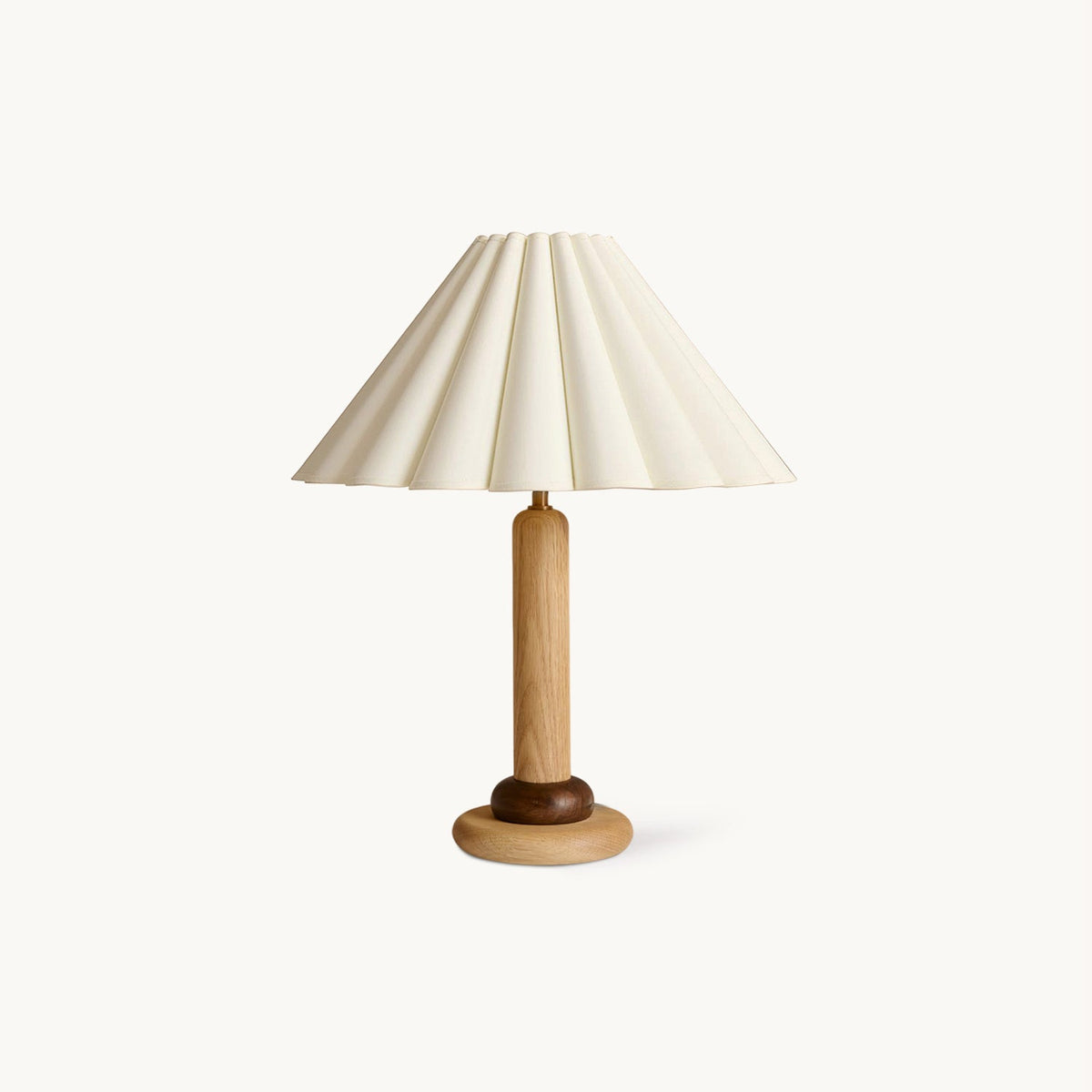 This Clérachic table lamp has a pleated cream shade on a slim wood stem and a rounded wooden base, shown on a plain white backdrop.