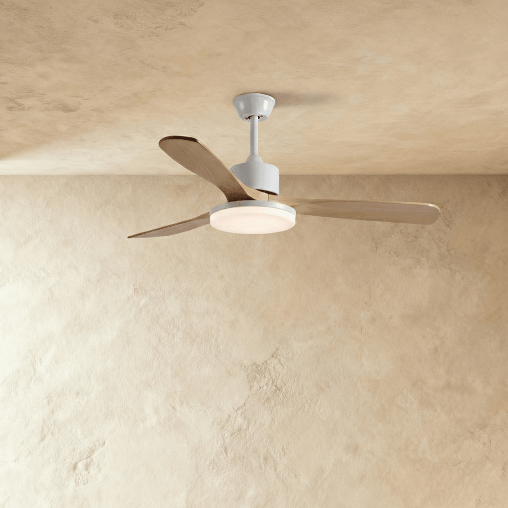 Clérachic ceiling fan on a short white downrod with three pale wood blades and a round LED light glowing underneath.