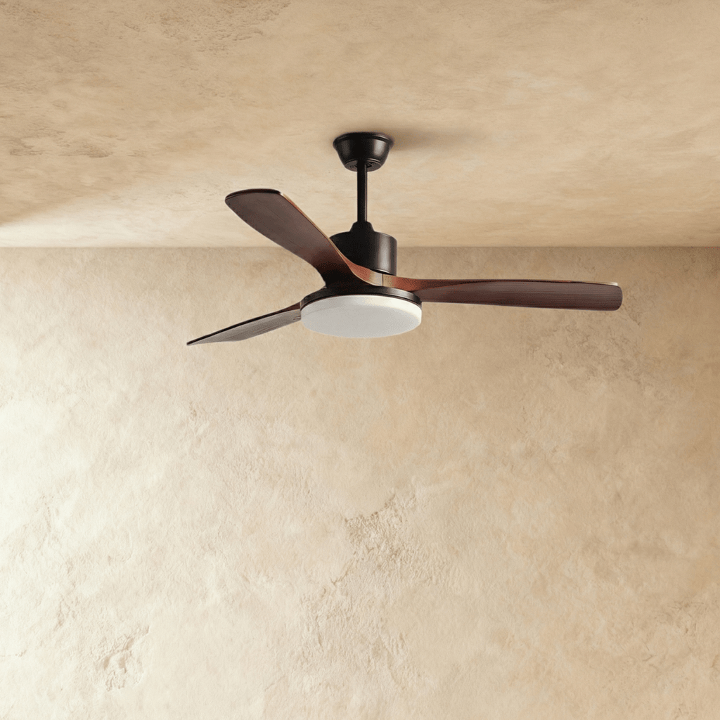 Clérachic ceiling fan on a black downrod with three dark walnut-toned blades, the round LED light panel unlit.