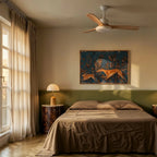 Clérachic white ceiling fan on a downrod with pale wood blades above a bed in a warm, sunlit bedroom with green headboard.