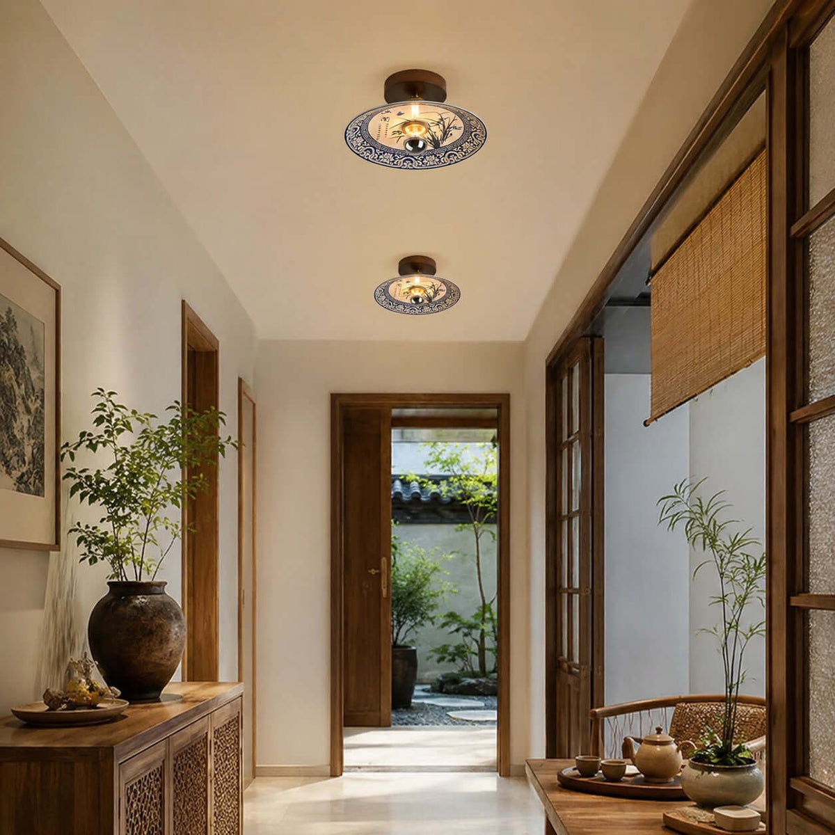 Two Clérachic ceiling lights, one behind the other, in a corridor with wood-framed doors and a view of a garden.