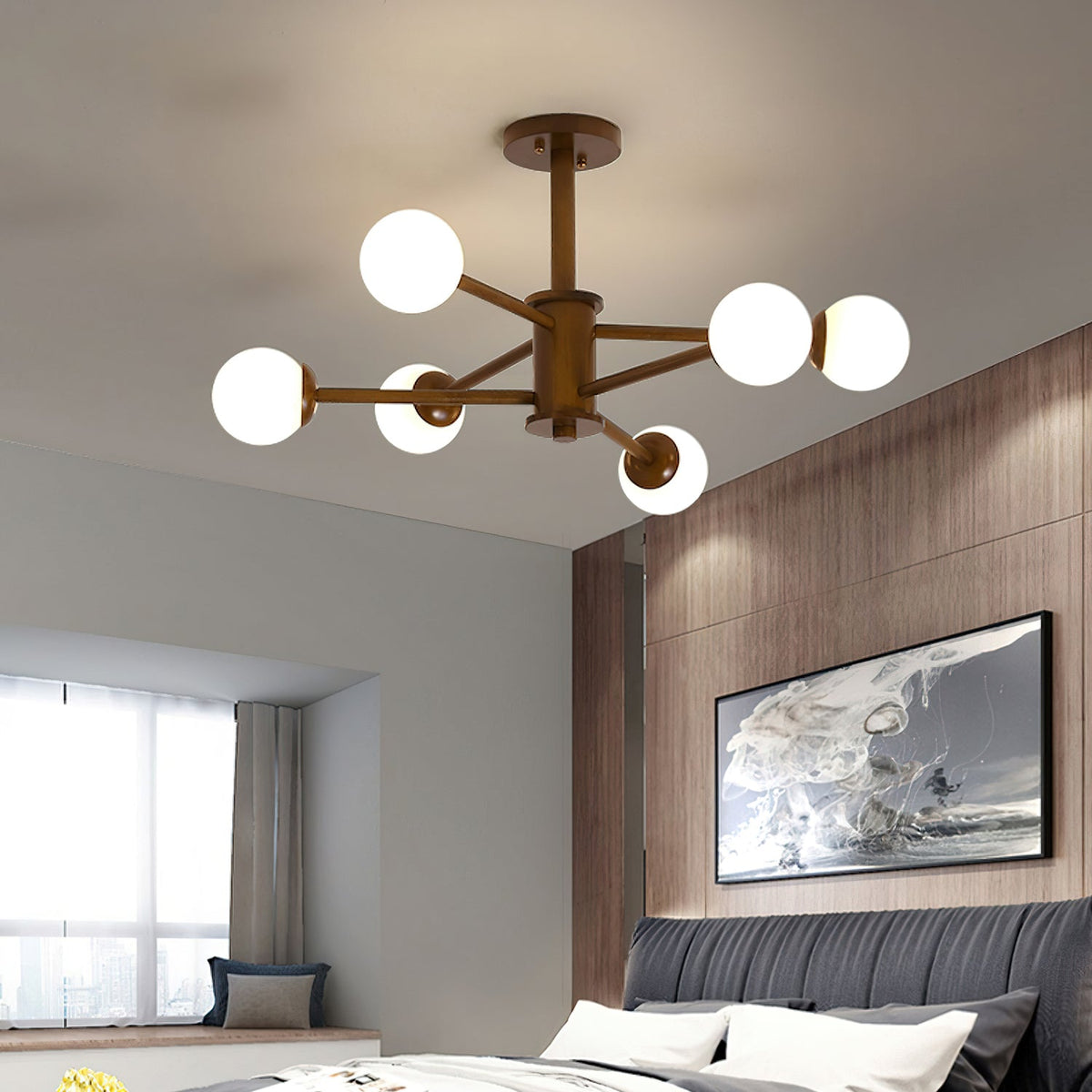 Walnut-toned Clérachic ceiling light with six white globes, lit over a bedroom with a grey tufted headboard and wood wall panelling.