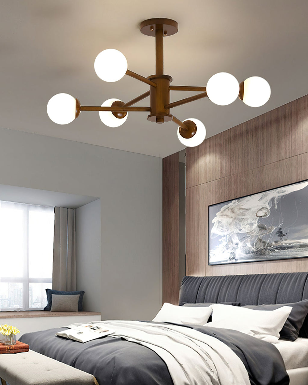 Walnut finish ceiling light from Clérachic with six white globes, hanging low over a bedroom with grey bedding.