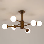 Walnut-toned ceiling light from Clérachic with six frosted globes spread on long arms, shown unlit against a grey ceiling.