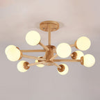 Wood and white Clérachic ceiling light with ten globes on branching pale arms, seen from below on a grey-pink ceiling.
