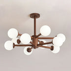 Walnut ceiling light from Clérachic, with white globes clustered around a dark wooden stem, against a grey ceiling.