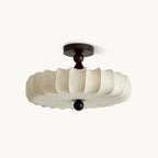 On a plain white backdrop, a Clérachic ceiling light with a pleated beige fabric shade, a dark walnut-colour canopy and a round wooden finial.