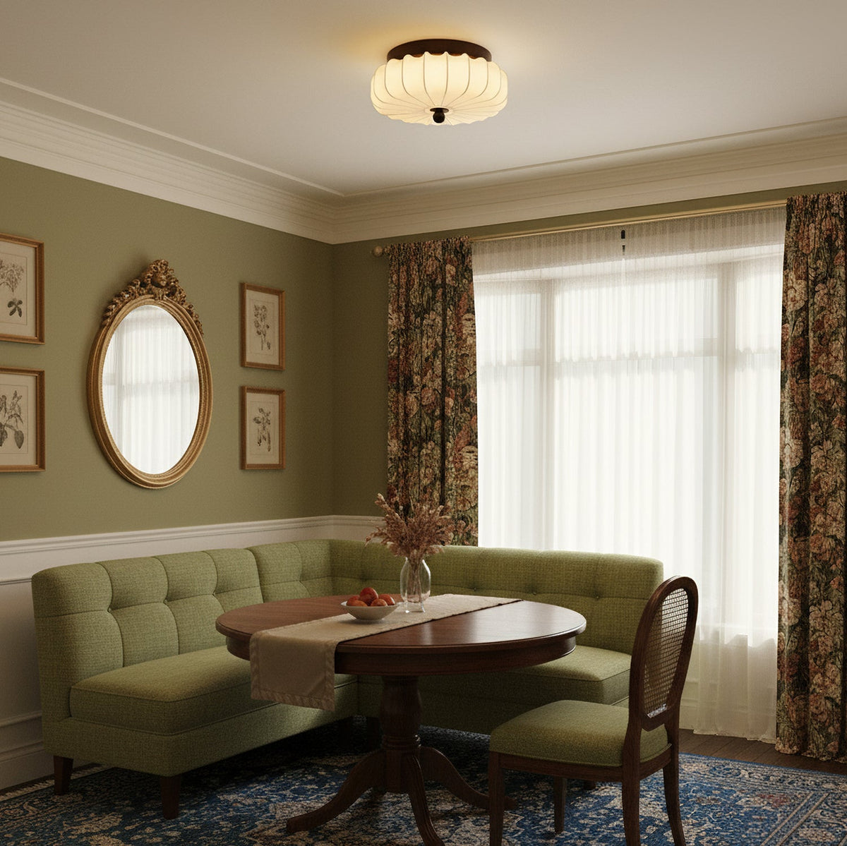 In a dining room with olive walls, a green banquette and floral curtains, this Clérachic ceiling light hangs flush with the ceiling.