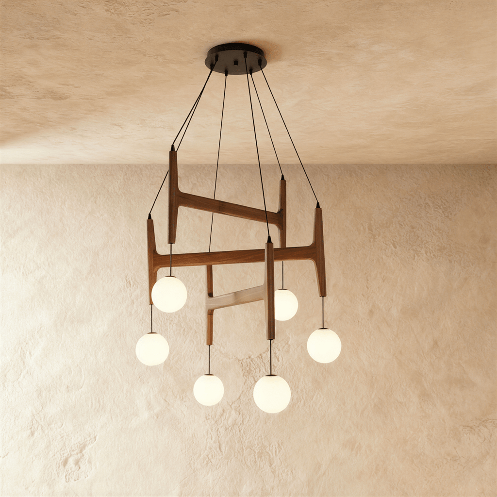 Clérachic's chandelier in dark red mahogany wood, six frosted glass globes suspended from its layered frame.