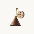 Walnut-colour cone shade on a brass gooseneck arm with a round wooden backplate, this Clérachic wall light on a plain white backdrop.