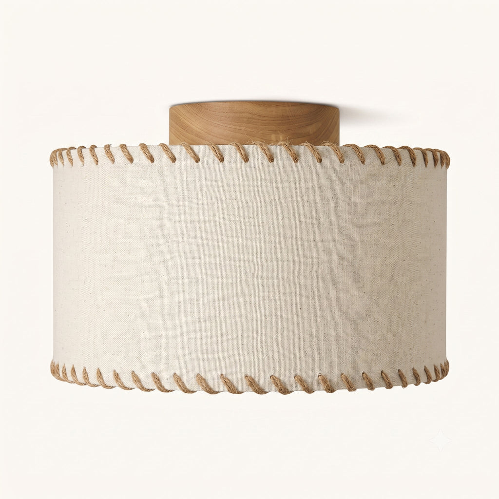 Front view of the beige linen shade on this Clérachic flush mount, showing the fabric texture and the twisted rope trim at top and bottom.