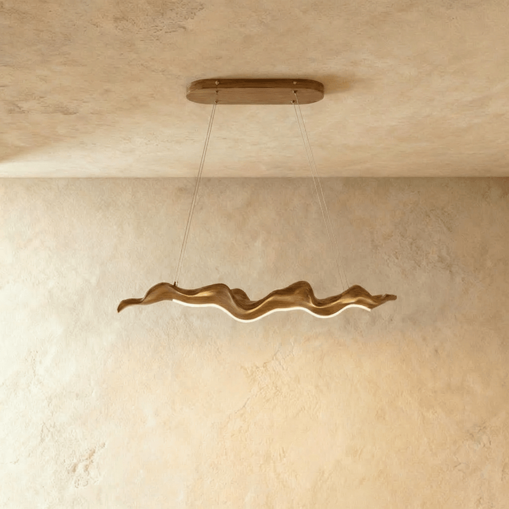 Clérachic wavy ribbon chandelier in warm wood tones, hung on two fine cables from an oval wooden canopy against a limewashed wall.
