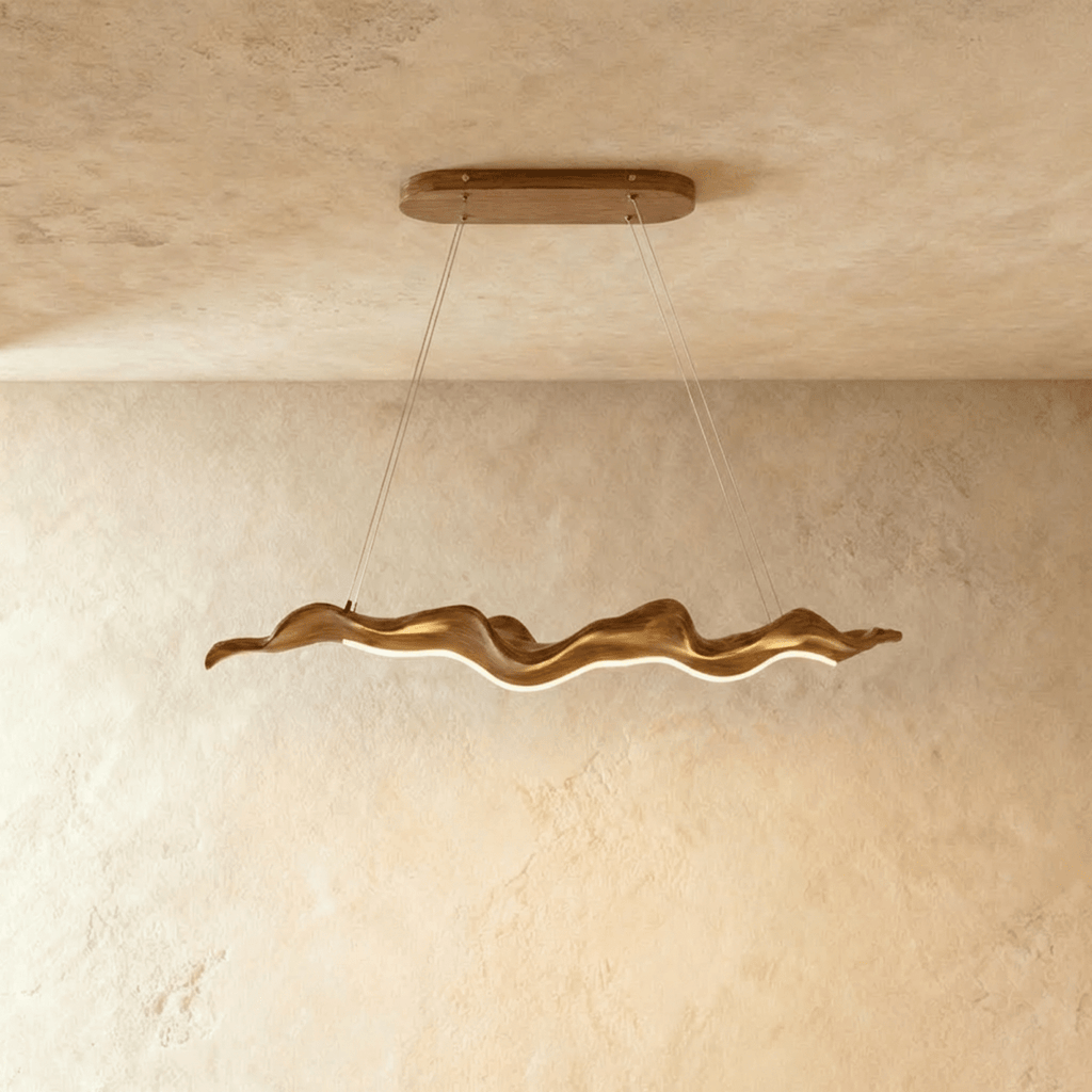 Clérachic wavy wood-finish chandelier, a longer size on two thin cables, with a warm LED line along its curved underside.