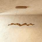 Clérachic wavy wood-finish chandelier, a longer size on two thin cables, with a warm LED line along its curved underside.