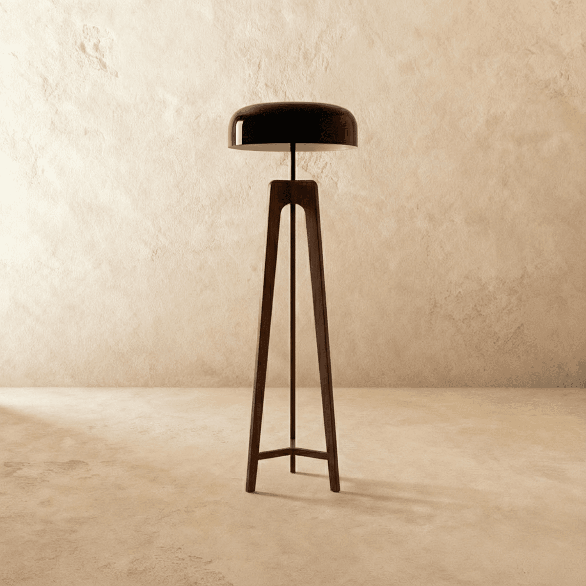 Clérachic tall dark wood tripod floor lamp with a black disc shade switched off, against a limewash wall.