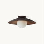 This Clérachic flush-mount ceiling light has a shallow dark wood-grain shade and a frosted white glass globe, shown on a plain white backdrop.