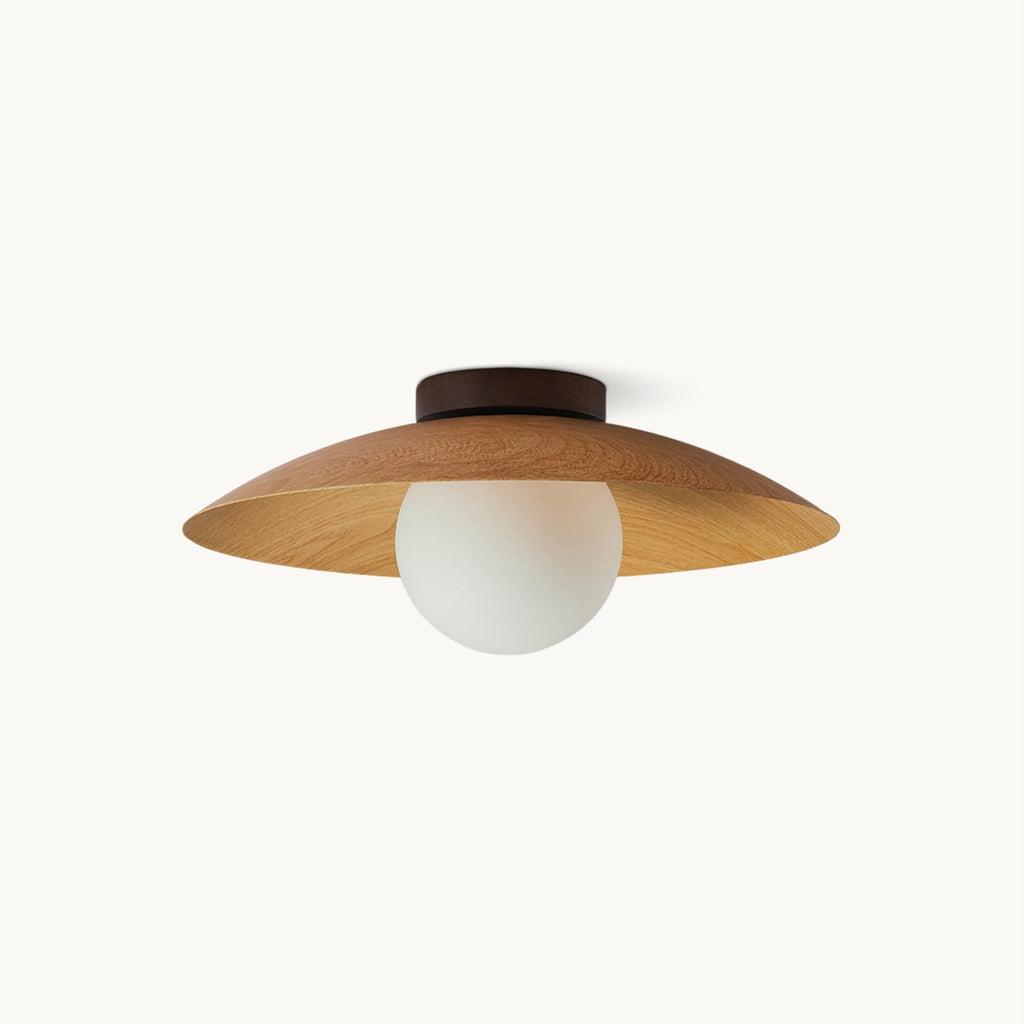 A Clérachic ceiling light seen from the side, with a natural wood-grain shade, a dark ceiling plate and a frosted glass globe, on white.
