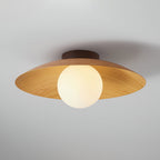 This Clérachic ceiling light in a natural wood-grain finish hangs a frosted globe under a wide shade, against a soft grey backdrop.