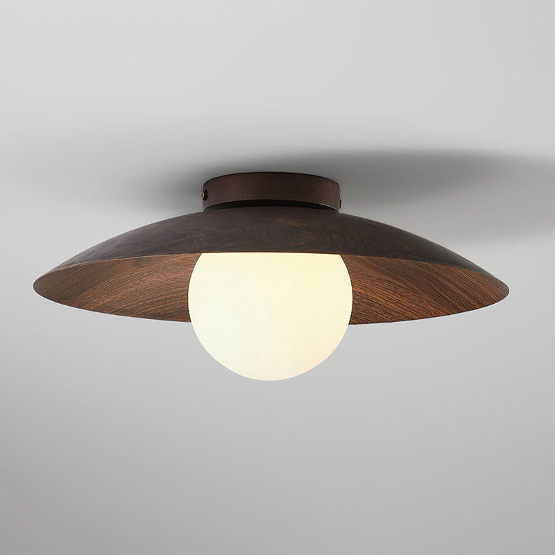 This Clérachic walnut-toned wood-grain ceiling light glows warmly through its frosted globe, with fine grain visible on the shade.