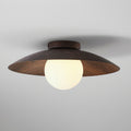 This Clérachic walnut-toned wood-grain ceiling light glows warmly through its frosted globe, with fine grain visible on the shade.