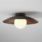 This Clérachic walnut-toned wood-grain ceiling light glows warmly through its frosted globe, with fine grain visible on the shade.