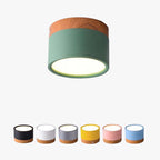 Green Clérachic Wood-Grain Cylinder Ceiling Light lit on a plain background above six alternative body colours.