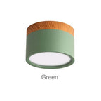 Clérachic Wood-Grain Cylinder Ceiling Light in Green, its white diffuser disc set inside a matte rim.