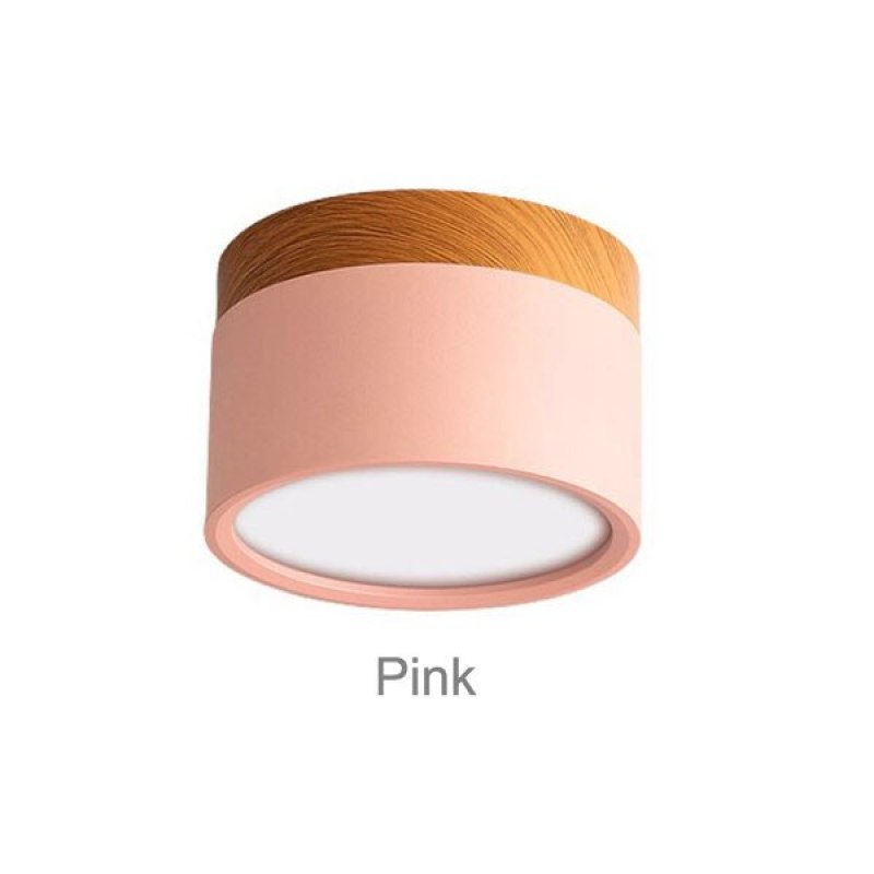 Clérachic Wood-Grain Cylinder Ceiling Light in Pink, the soft blush body sitting under a wood-grain collar.