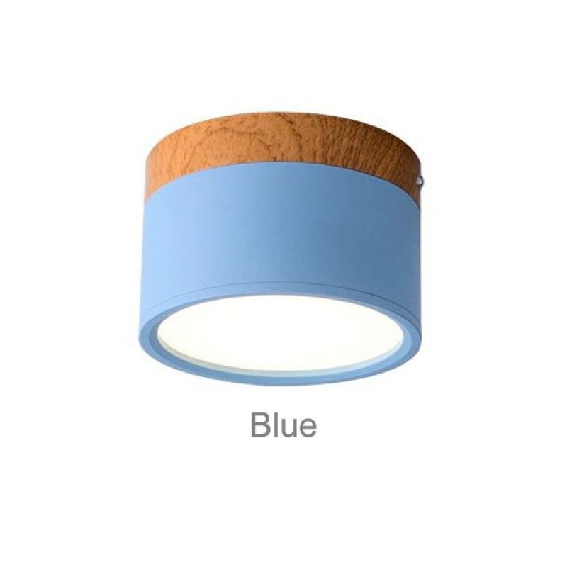 Clérachic Wood-Grain Cylinder Ceiling Light in Blue, a soft sky-blue body beneath its wood-grain cap.