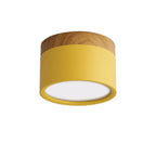 Clérachic Wood-Grain Cylinder Ceiling Light in yellow, unlit, showing the recessed white disc at the base.