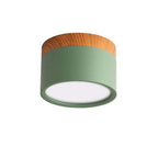 Clérachic Wood-Grain Cylinder Ceiling Light in green, unlit, its matte olive body set against plain white.