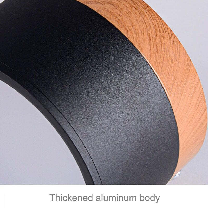 Close-up of the Clérachic Wood-Grain Cylinder Ceiling Light's thickened aluminium body where black meets the wood-grain collar.