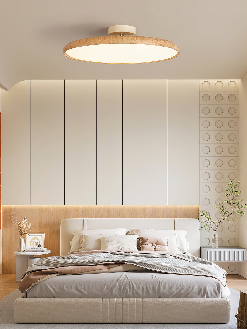 Light wood-grain Clérachic ceiling light seen from below, over a double bed with a pale quilt and warm wall panelling.