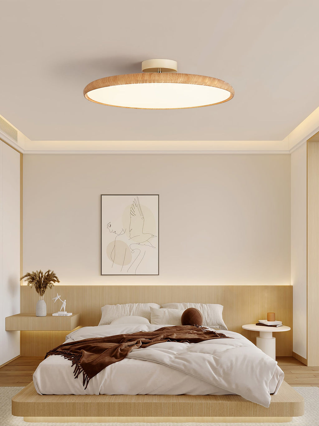 A light wood-grain Clérachic ceiling light in a bedroom with glowing cove lighting and a low platform bed.