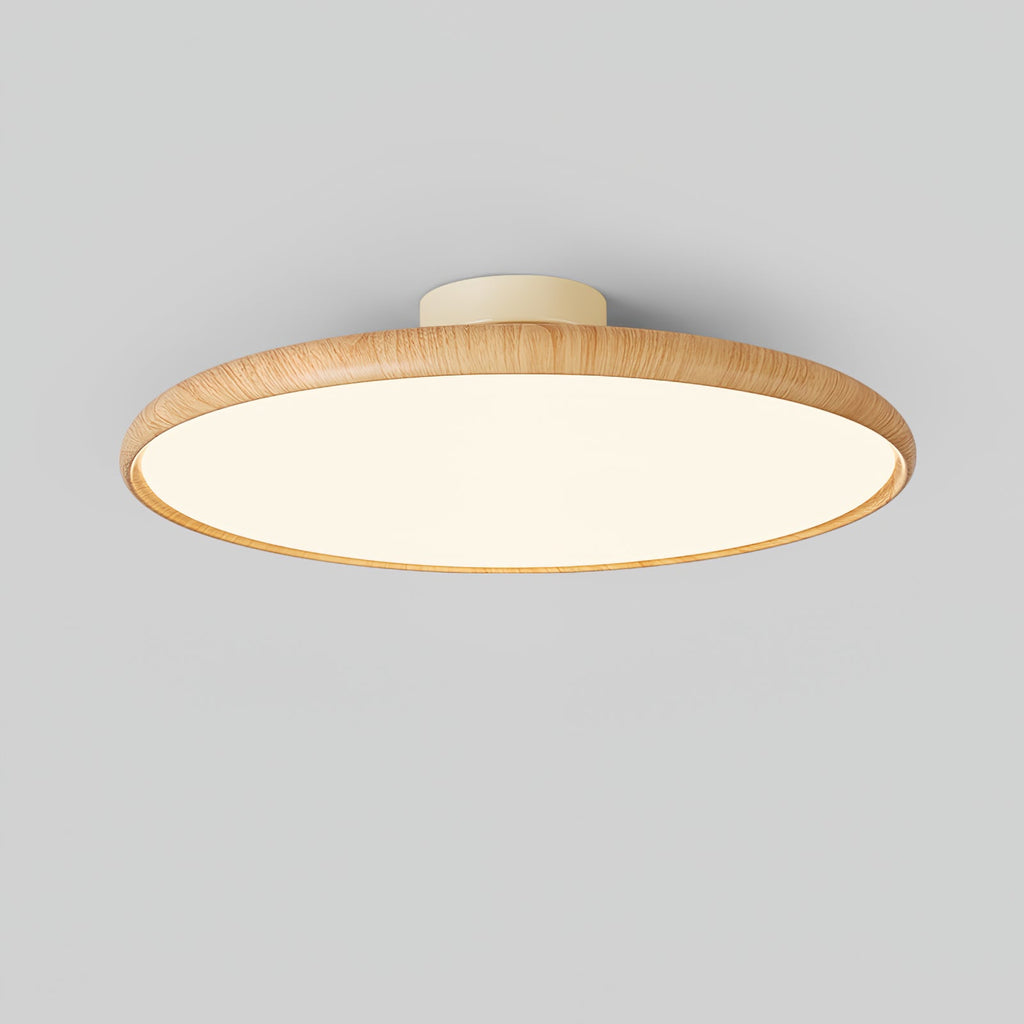 Light wood-grain Clérachic ceiling light with a lit white diffuser, shown from below at an angle against a grey backdrop.