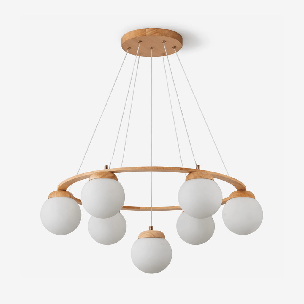 Seven frosted white glass globes hang from a light wood ring on fine wires and a round wood ceiling plate, on this Clérachic chandelier.