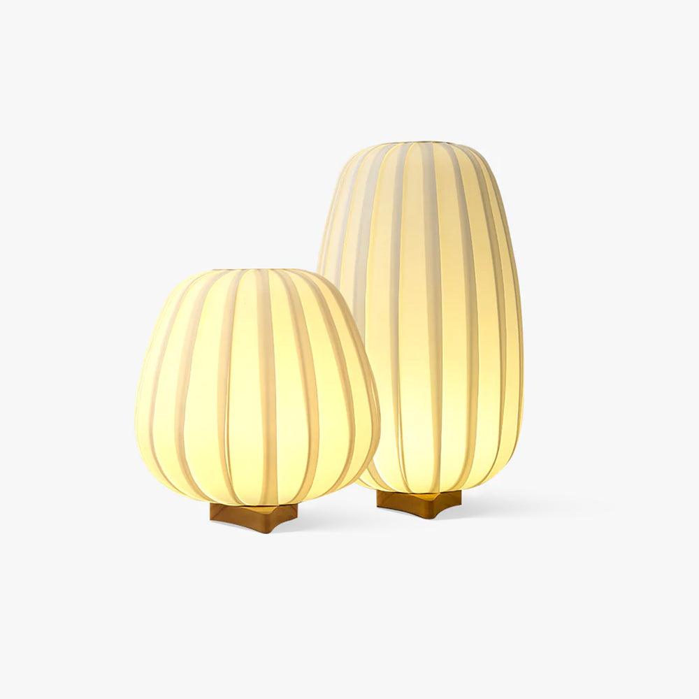Two glowing ribbed fabric lamps, one round and one tall, on small wooden bases, this Clérachic pair shown on a plain white backdrop.