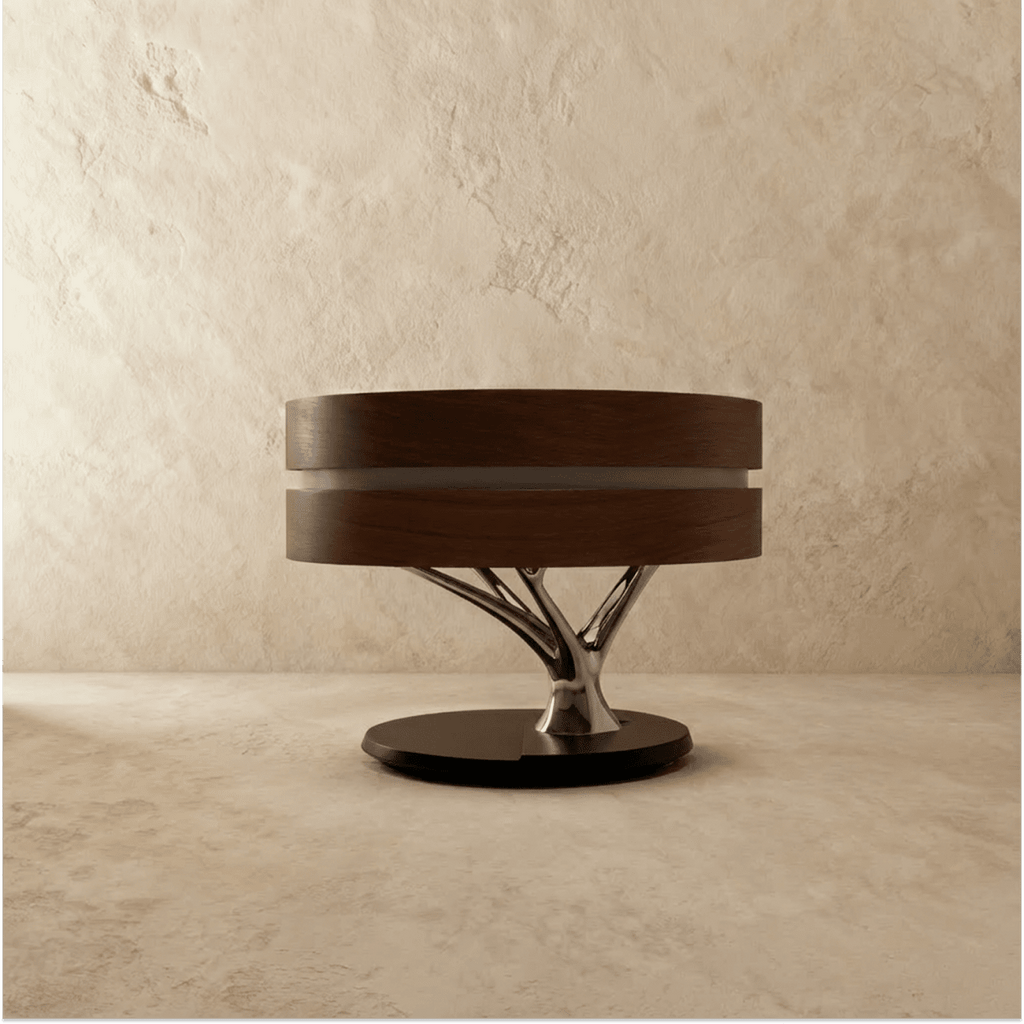 Clérachic drum table lamp switched off, a dark wood shade over a polished chrome branch stem and a black round base.