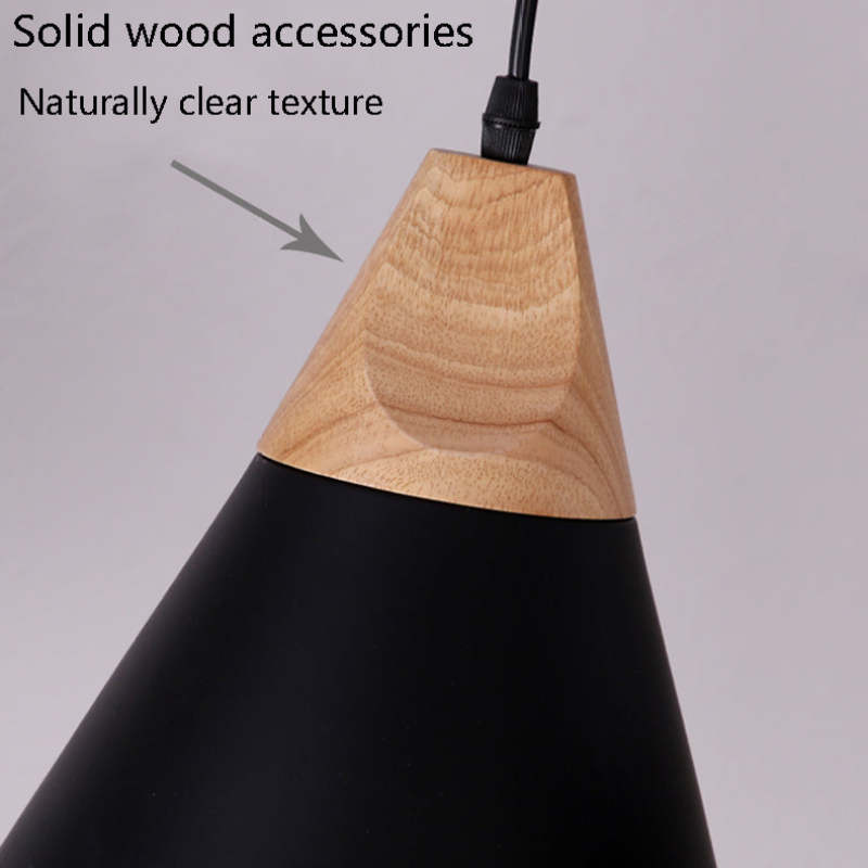 Close-up callout on the Clérachic cone pendant's solid wood cap, showing its naturally clear grain.