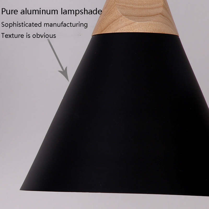 Close-up callout on the Clérachic cone pendant's pure aluminum shade, highlighting its smooth painted texture.
