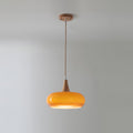 Clérachic Wood-Top Glass Pendant Light in amber glass, a single lit head hanging from its round wood ceiling canopy.