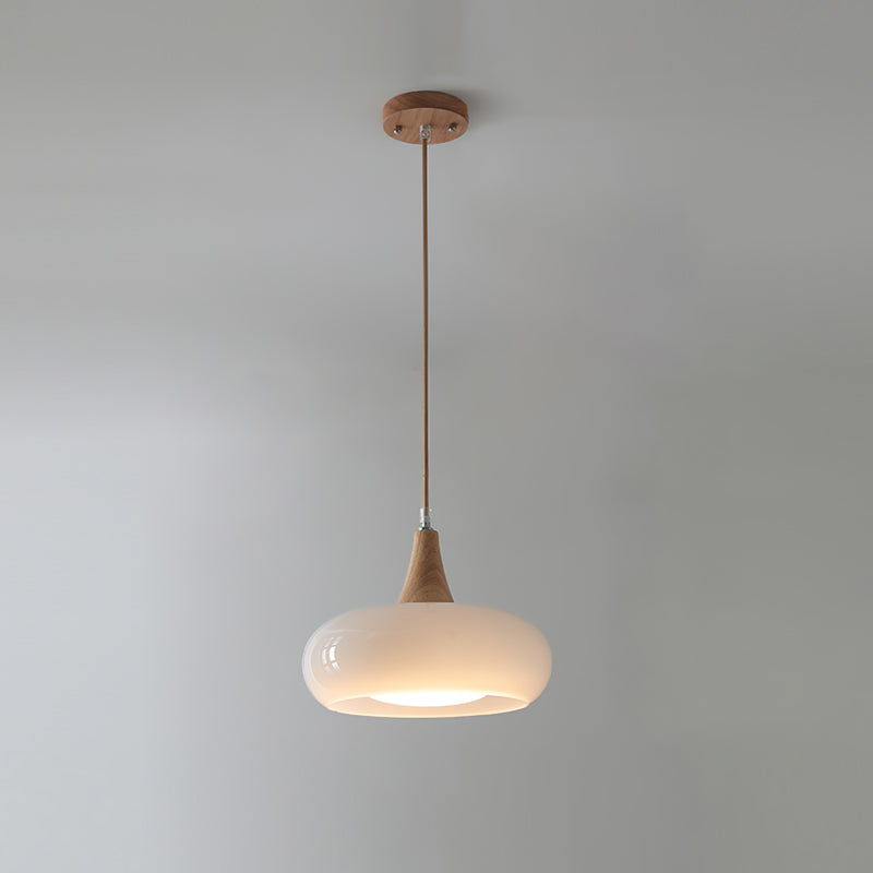 The Clérachic Wood-Top Glass Pendant Light in opal white glass, one head glowing softly beneath its turned wood cap.