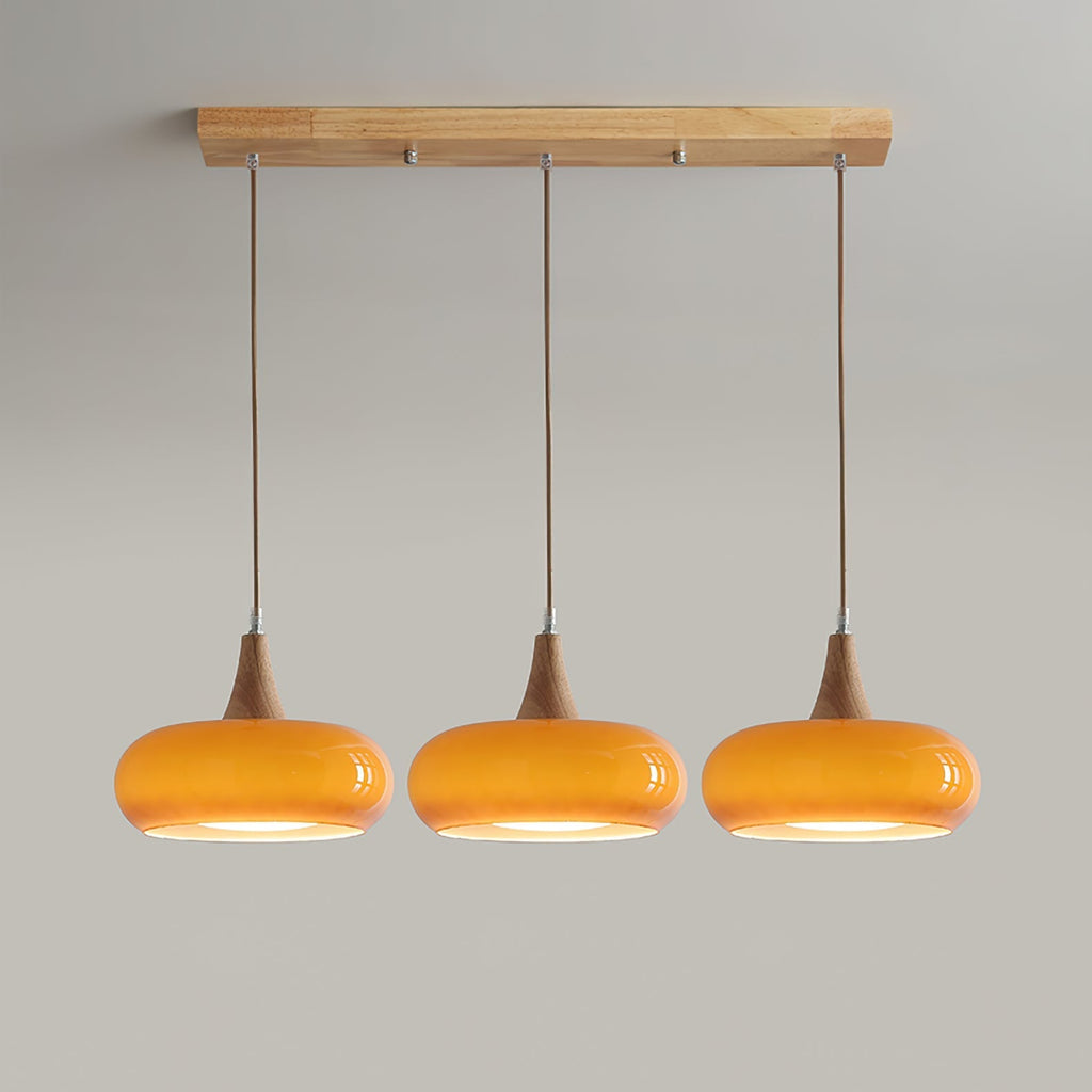 Clérachic Wood-Top Glass Pendant Light in three-head amber, a straight-on view showing the full drop of each braided cord.