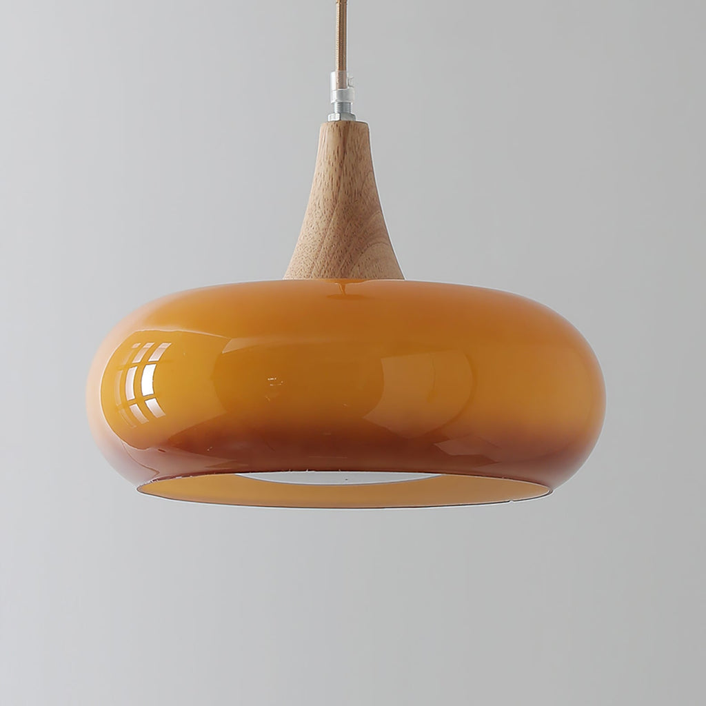 Close-up of the amber Clérachic Wood-Top Glass Pendant Light, its open rim revealing the recessed white diffuser disc inside.