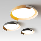 Three Clérachic ceiling lights in light wood, grey and black finishes, shown lit and overlapping on a soft grey backdrop.